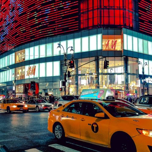 time lapse phot oof a yellow car