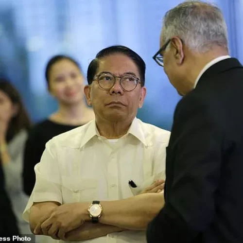 In this March 2, 2017 photo, Filipino Jose E.B. Antonio, chats before the start of a forum at the Manila Polo Club in the financial district of Makati, Philippines. Trump’s partner in a Philippines venture, Jose E.B. Antonio, was named a "special envoy" to the U.S. by Philippine President Rodrigo Duterte on Oct. 28, less than two weeks before the November 2016 U.S. election. Antonio is chairman of Century Properties Group Inc., which partnered with Trump for the branding of the posh Trump Tower in Manila’s Makati business district. (AP Photo/Aaron Favila)